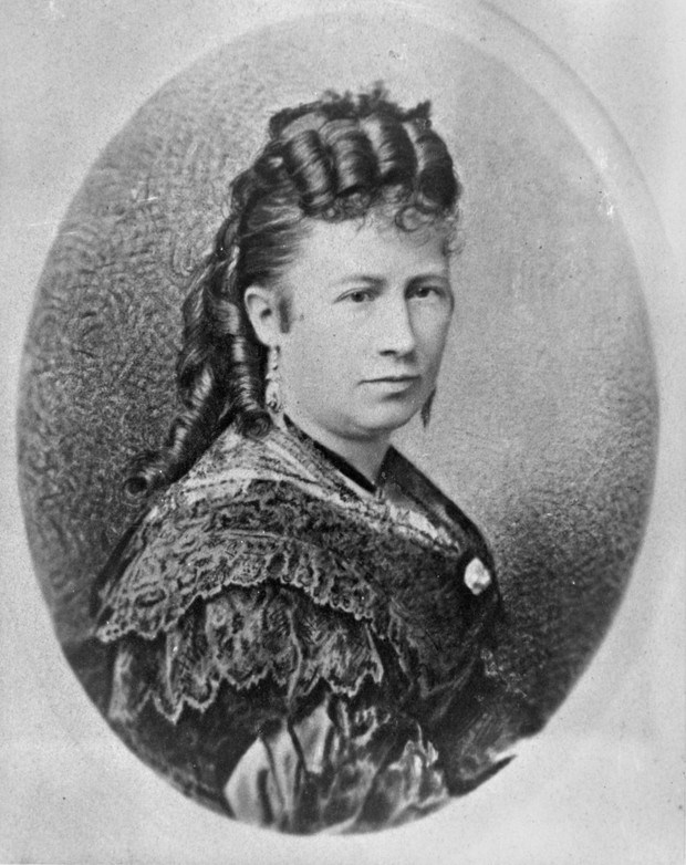 drawing of woman with brown hair and long dress.