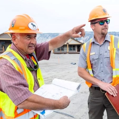 two construction workers at a site