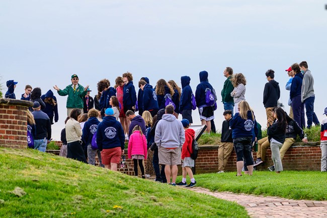VIP Lou giving a program to visitors on the ramparts of the fort