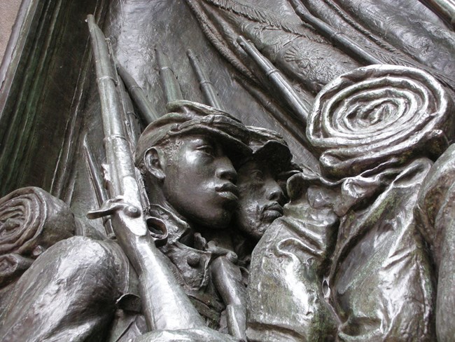 Close-up of men in the Shaw 54th Memorial.