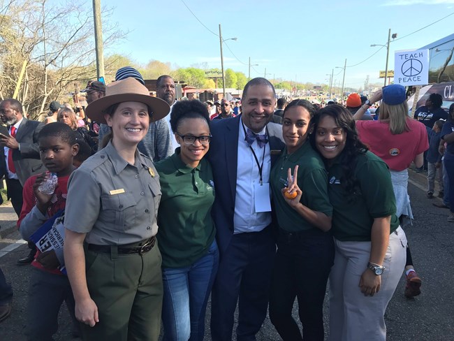 Floyd Myers, a Park Ranger, and two Greening Youth Foundation interns at the 55th anniversary of Selma March event