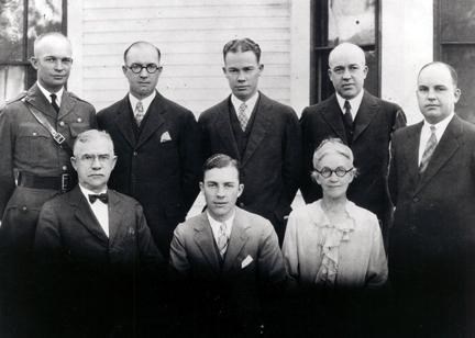 A black and white image of the Eisenhower family standing together for a photograph