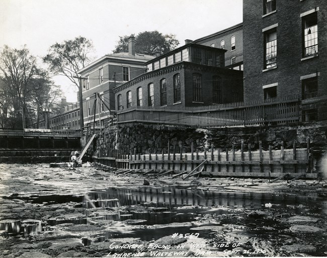 Accumulated waste near a mill in early twentieth-century Lowell.
