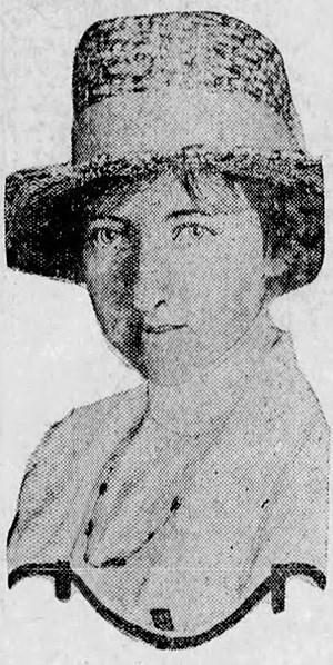 Newspaper photo of Helen Pratt posing wearing a high-necked blouse and a hat.