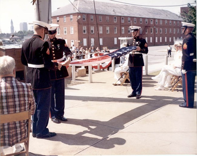 Marines folding the US Flag at the Charlestown Navy Yard.