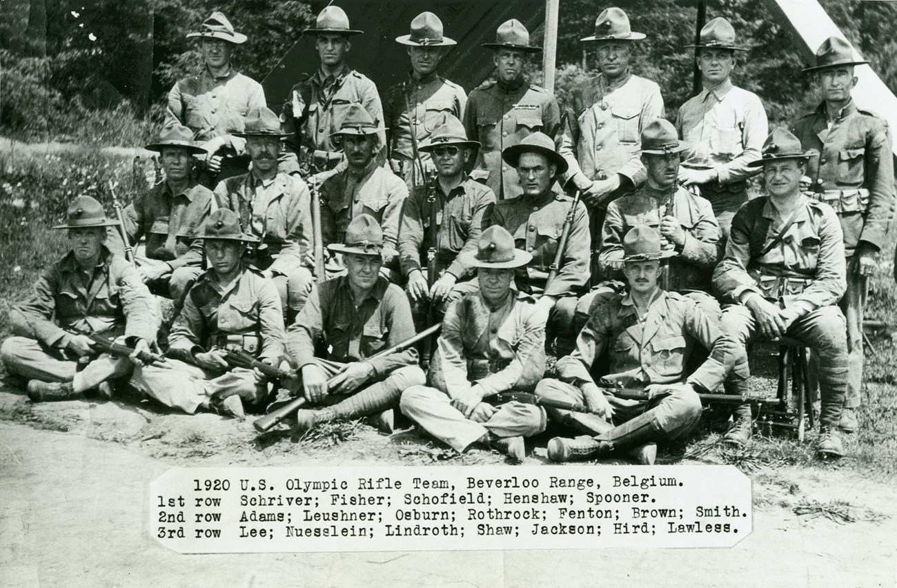 Black and white photo of over a dozen men in military uniforms with a caption displaying all of their names.