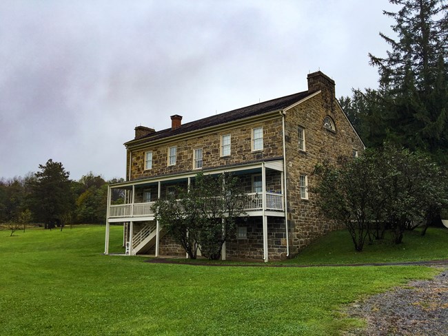 A stone house (Lemon House) in a green field