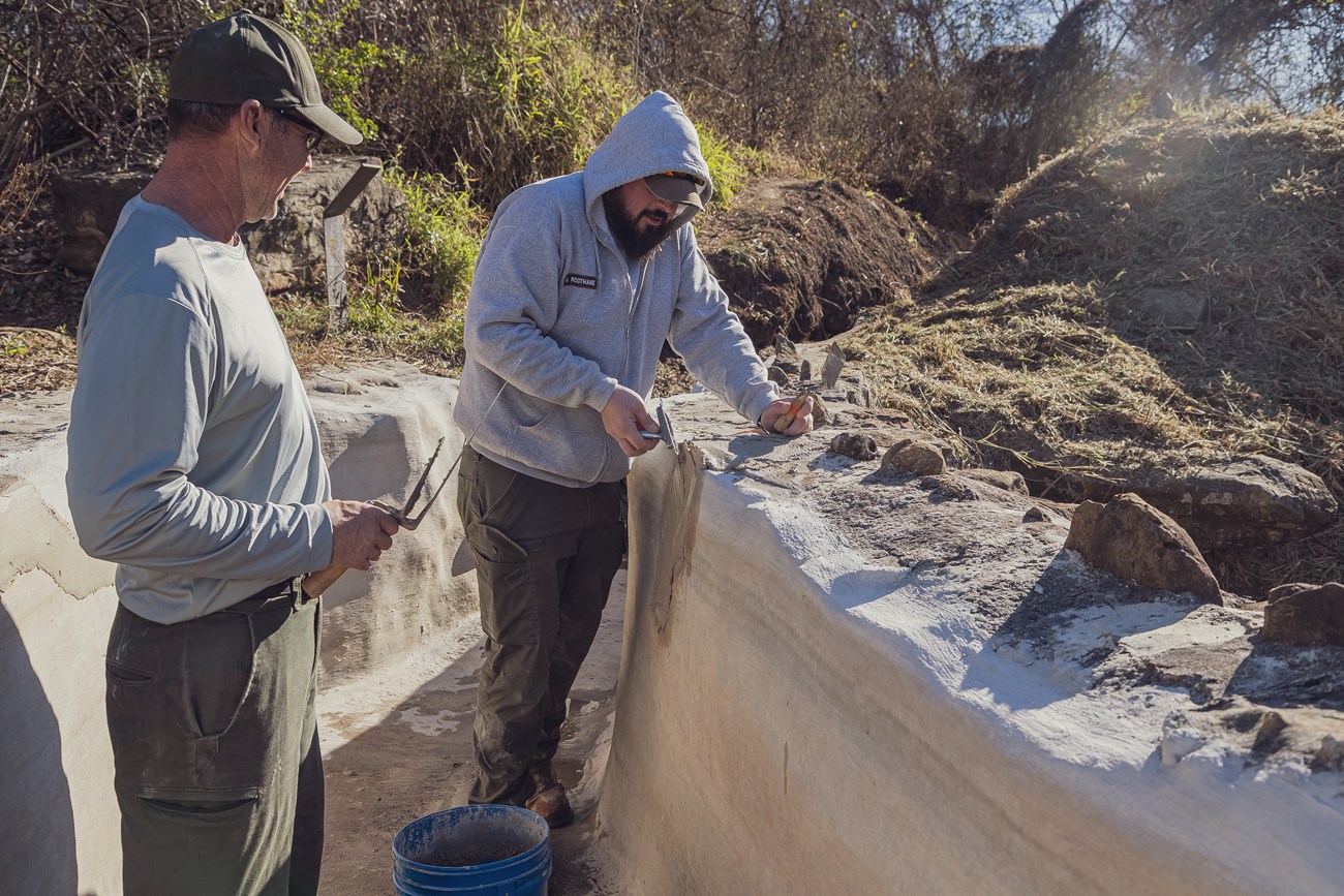 Espada Aqueduct Masonry with two HPTC staff