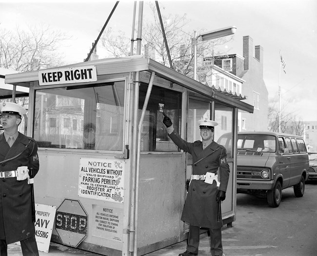 Marine standing outside of a guard booth.