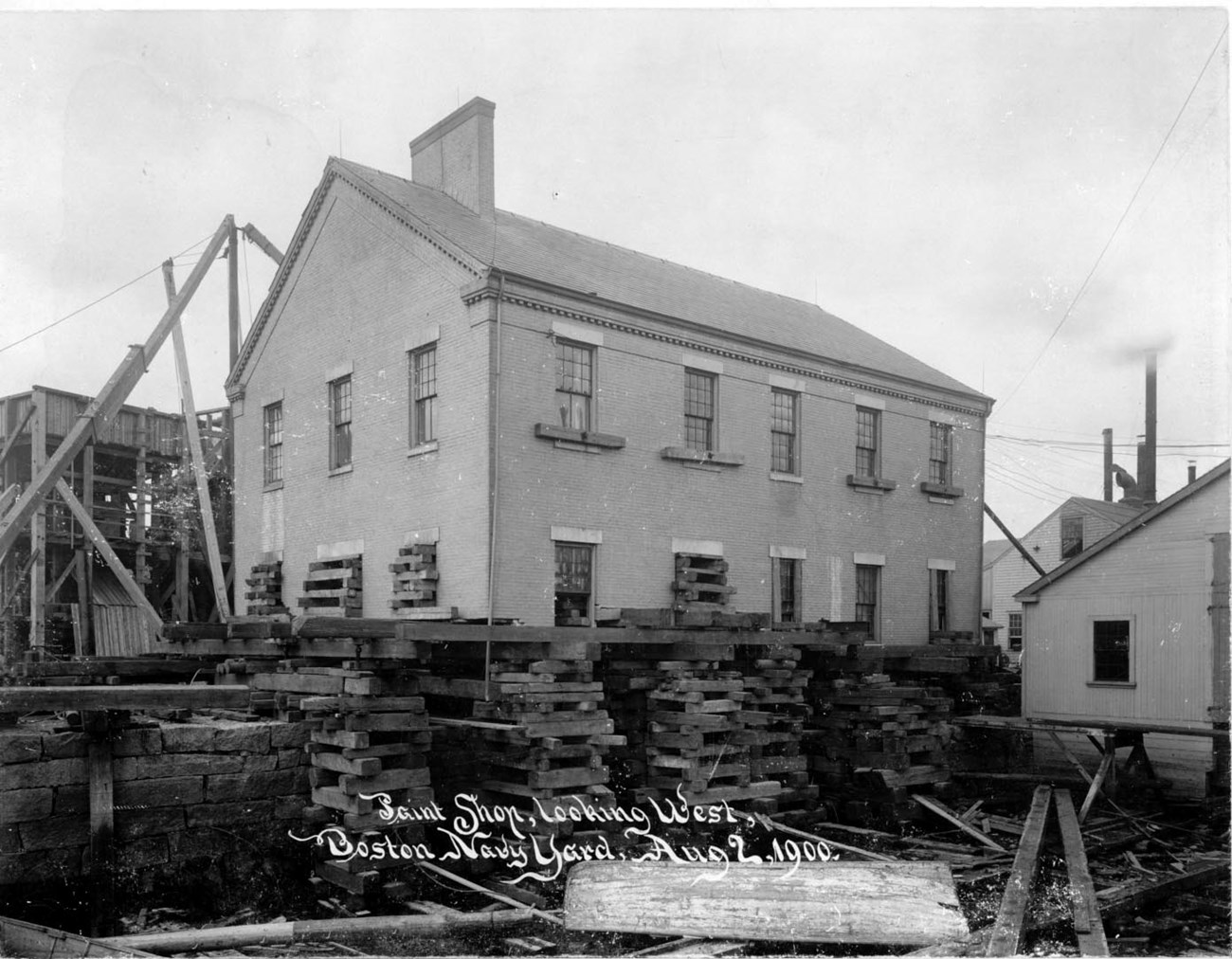 Building 10, a two story 3 pane by 5 pane building, surrounded by construction.