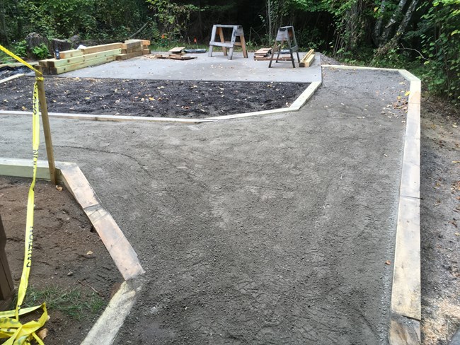 Compacted crushed stone walkway at the site of the new comfort station.