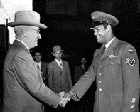 President Truman and African American Soldier President Truman shaking the hand of an African American soldier