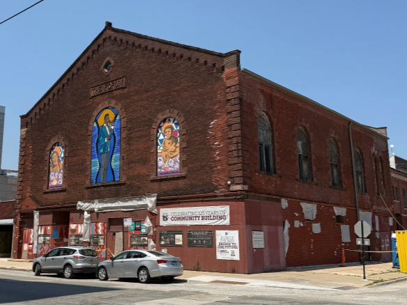 red brick building with beautiful stained glass windows