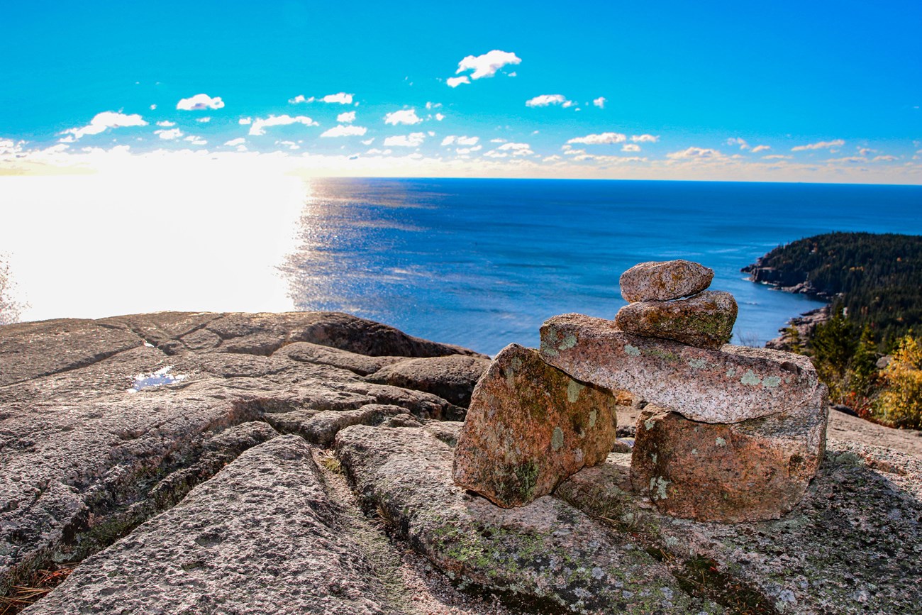 stacked rocks on a seaside cliff