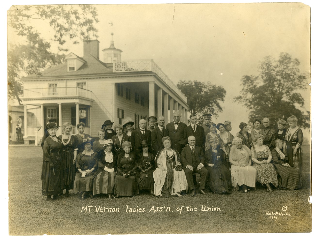 Mount Vernon Ladies Association, 1921 Alice Longfellow poses with 30 other men and women on the lawn of George Washington's home, Mt. Vernon.