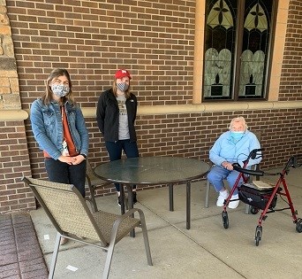 Authors Abbey Parten and Hayley Piippo standing outside with Jean Bolton.