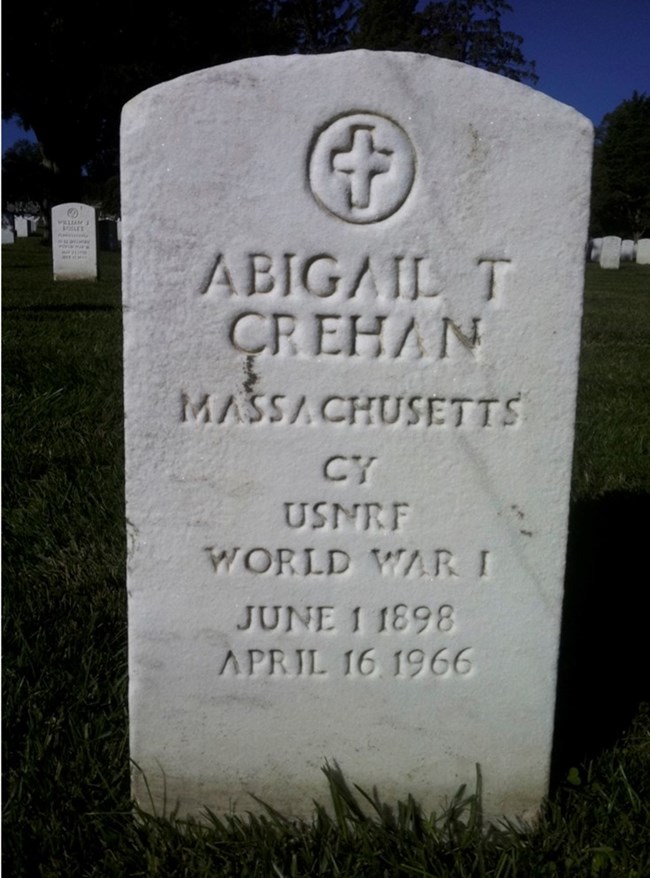 Color photograph of marble headstone with cross and name Abigail T Crehan