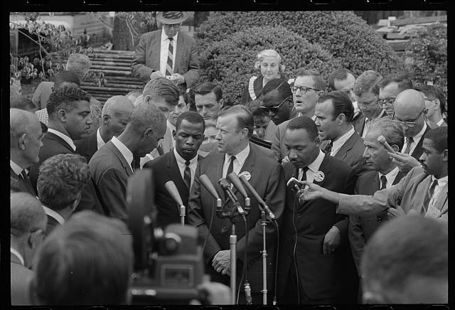 Civil Rights leaders are surrounded by reporters after the March on Washington.
