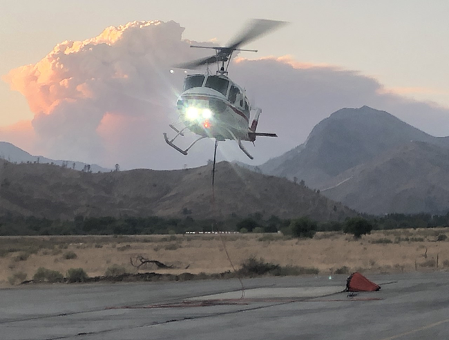 Helicopter in mid-air H66HJ, an AFS contracted Bell 205A1++ out of Galena Zone assigned to the Windy fire in Southern California, returning at the end of shift to Kernville from doing bucket work. (Christopher Havener, NPS).