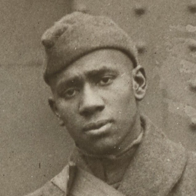 African American Soldier wearing World War One uniform looking at the camera