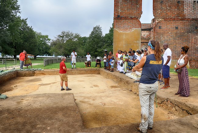 Angela Project Archeologists meet with community members