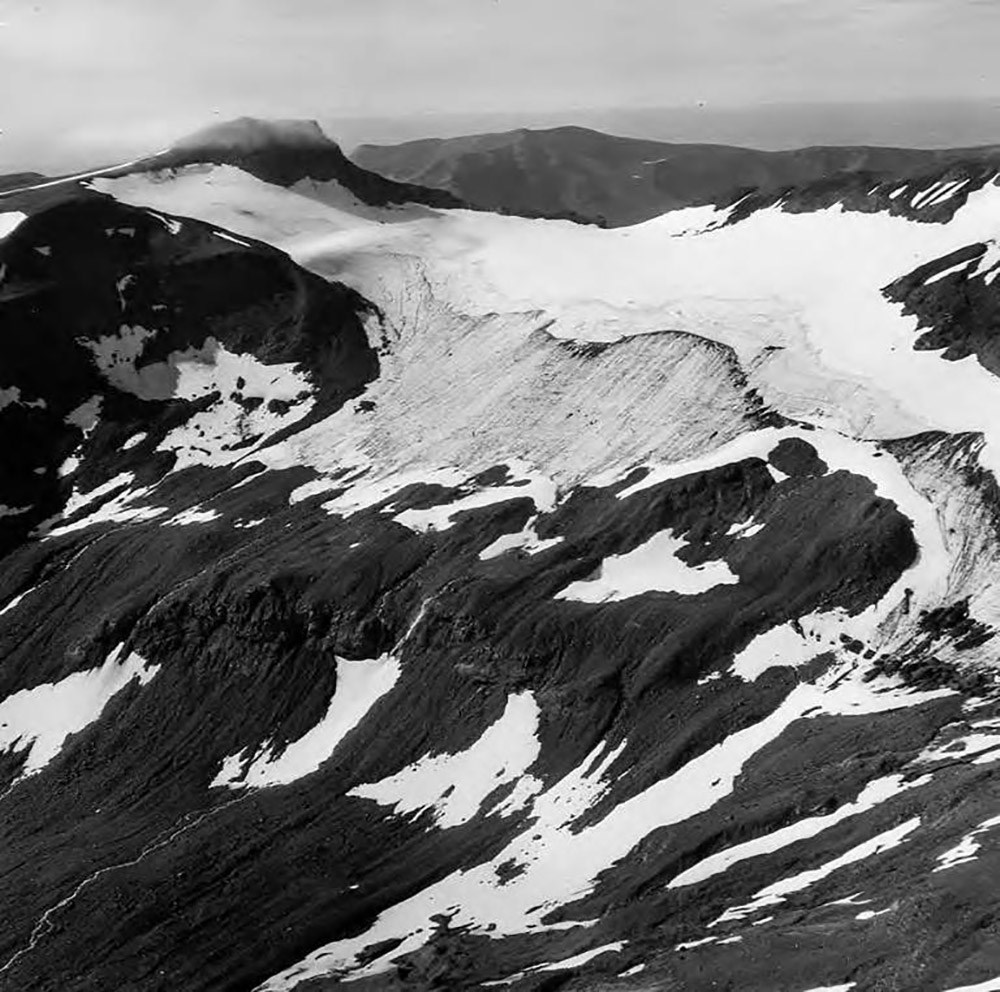 Aniakchak_Crater_and_Rim_Glacier,_terminus_of_mountain_glacier_and_firn_line_on_rim_of_valley_wall,_August_24,_1960_(GLACIERS_7063) An historical photo of Aniakchak Caldera and glaciers.