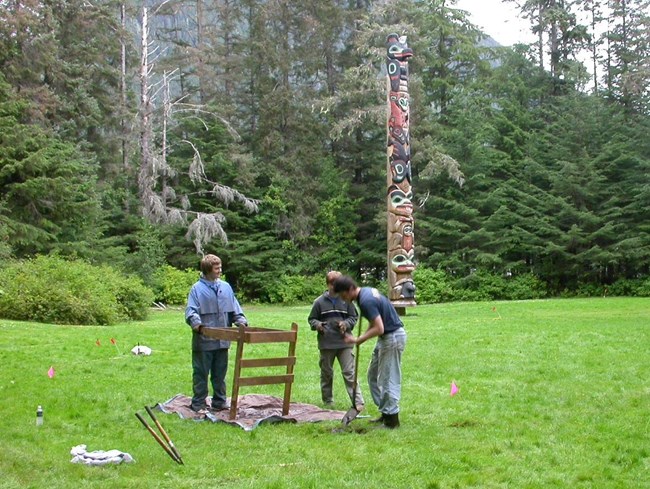 Archeologists at a screen