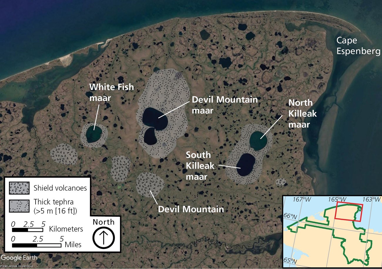 vertical aerial photo of a point of land by the sea that is pockmarked with wetlands and volcanic features