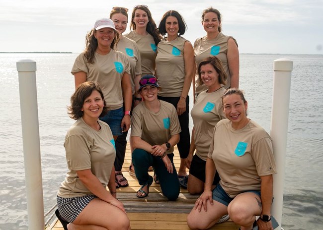 Group a WAVES divers standing on a boat