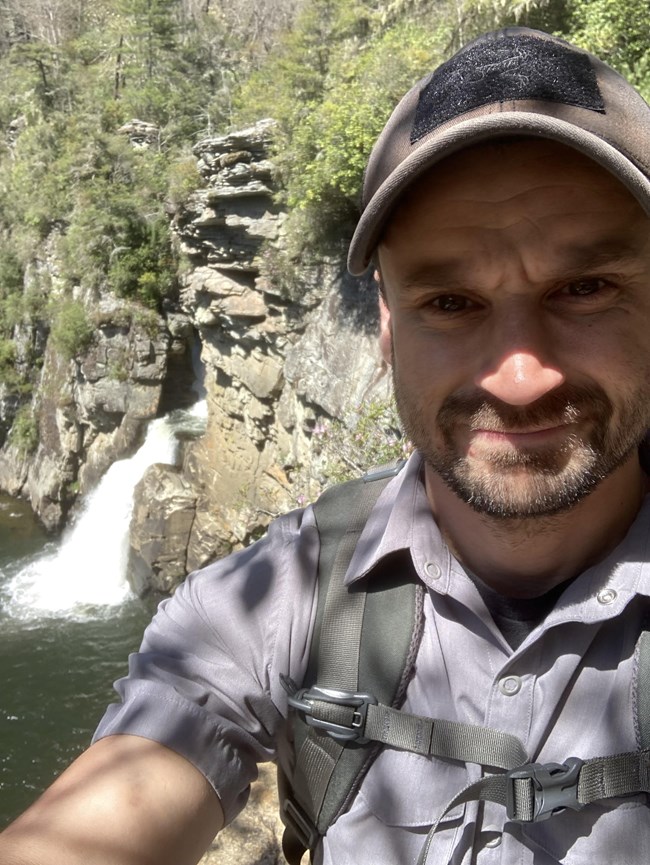Neal Wilcox at Linville Falls a selfie of Trails Program Coordinator Neal Wilcox, with the falls in the background