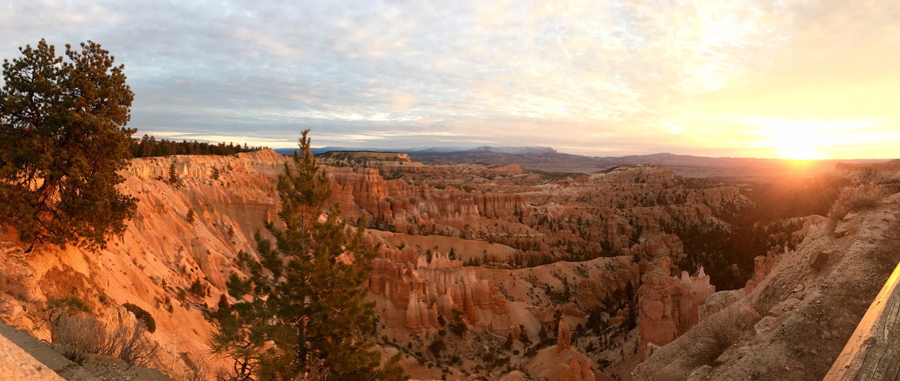 sunrises over canyon of hoodoos, a geologic formation