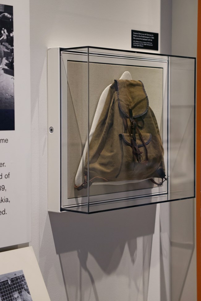 Canvas backpack in a display case at the DHHRM Canvas backpack in a display case