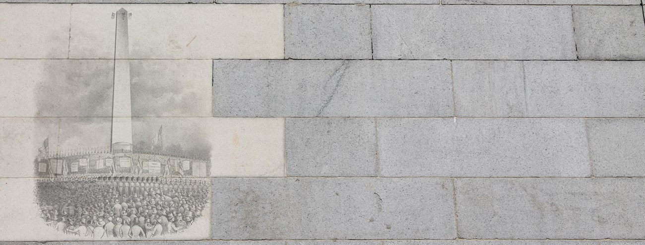 photo of granite blocks. some of the blocks are overlayed with a historic image of the Bunker Hill Monument, surrounded by a crowd of people.