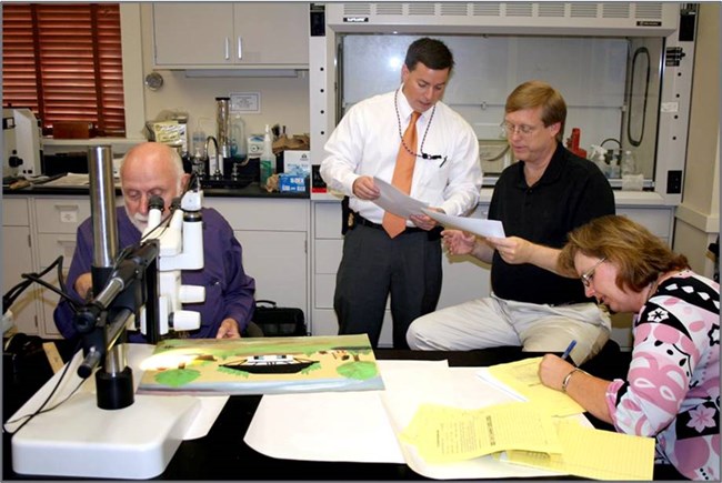 Randy Deaton looks on as Joe Barabe analysis Hunter works at NCPTT. Randy Deaton looks on as Joe Barabe analysis Hunter works at NCPTT.