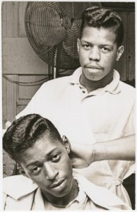 African American Barber and customer with conked hair.