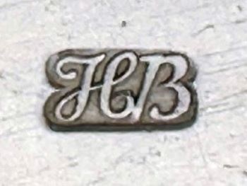 lt= A hallmark with the letters HB.