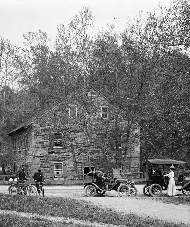 Bicyclists and drivers at Peirce Mill ca. 1918-1920 Historic image of bicyclists and drivers at Peirce Mill