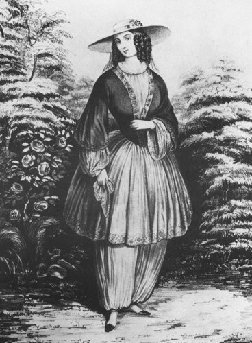 An illustration of a women in period dress, wearing historic bloomers.