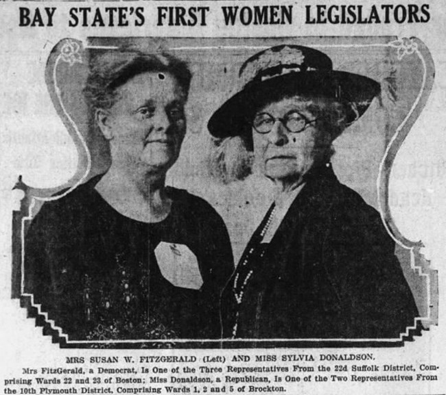 two older, middle-aged women, one wearing a hat and round glasses