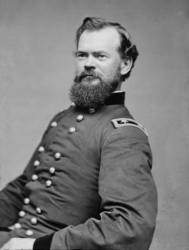 Black and white portrait of a civil war soldier in uniform facing left