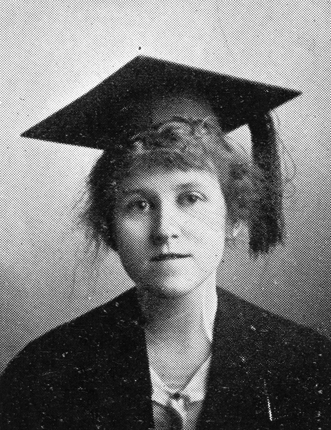 Esther Brazell poses in a cap and gown for graduation.