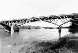 Bryan Bridge arched bridge with river flowing underneath, black and white
