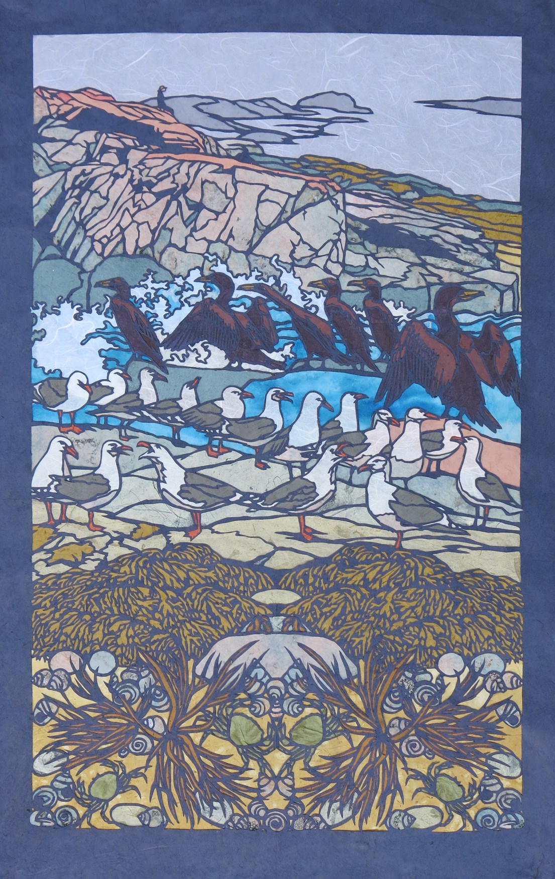 Scenic illustration made of layers of precisely cut paper depicting a person sitting on rocks looking out at the sea, birds, seaweed, and tidepool creatures. Scenic illustration made of layers of precisely cut paper depicting a person sitting on rocks looking out at the sea, birds, seaweed, and tidepool creatures.
