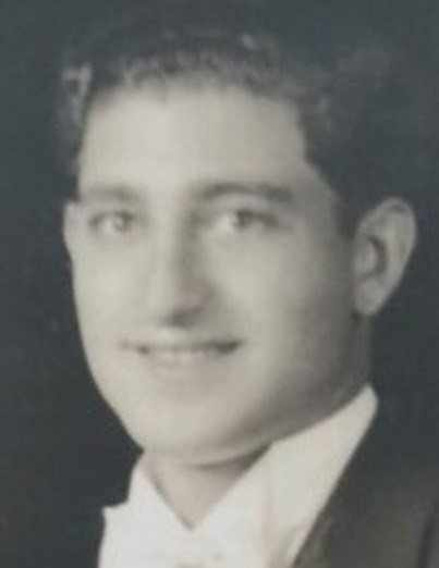 Frank Buda Portrait of a young man in a suit.