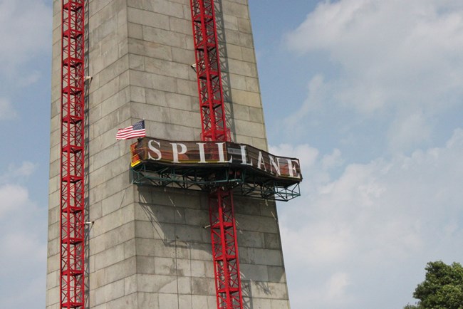 Bunker-Hill-Spillane Construction tracks run up two sides of the Bunker Hill Monument with a platform in the middle of the track.