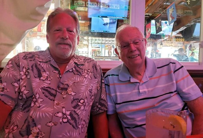 Burt & Jeff Meyers 2 men sitting together at a table