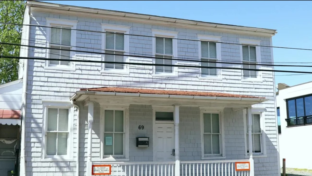 A white clapboard house.