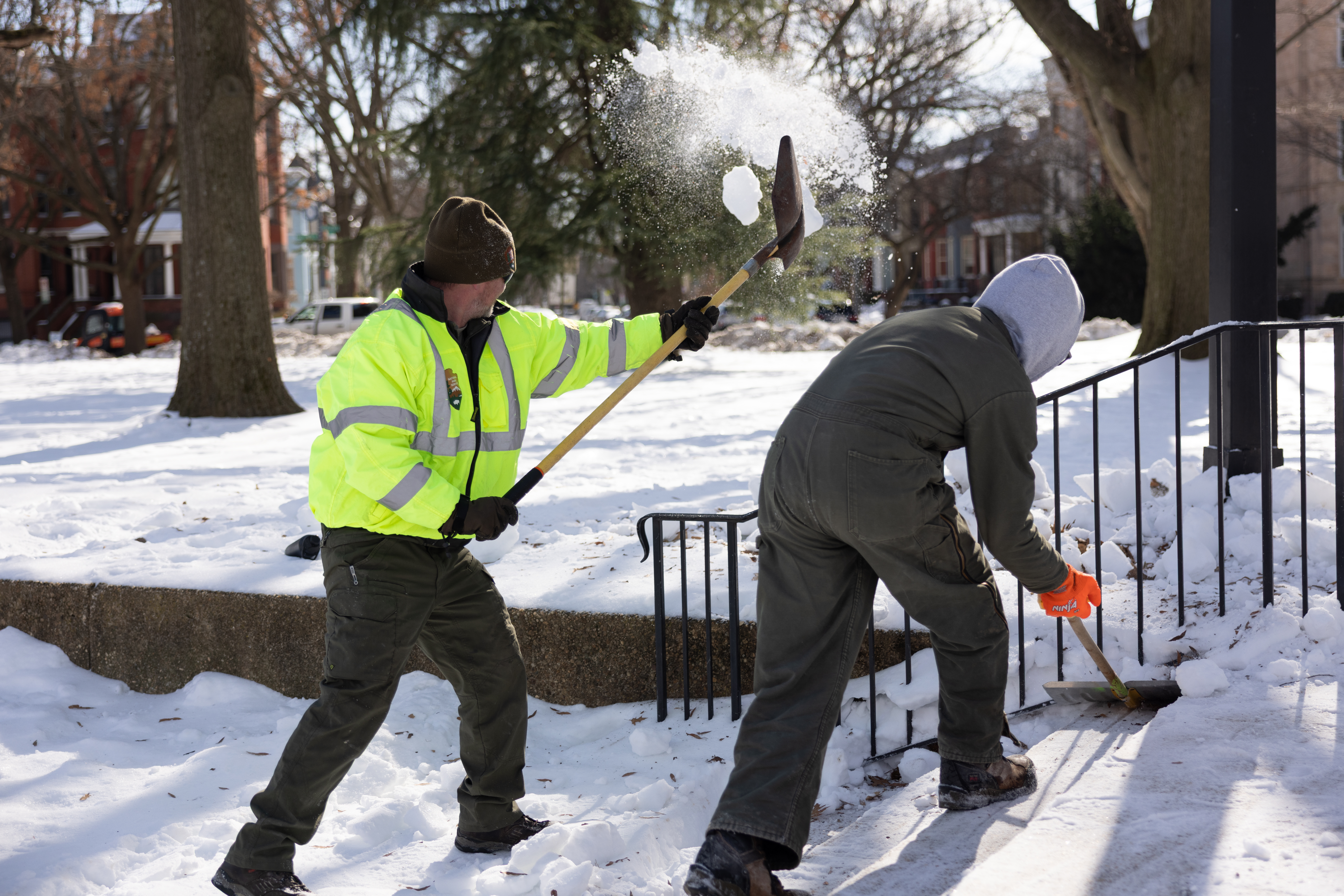 NPS staff removes snow from stairs