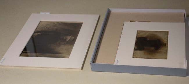 Two glass negatives laid in mats
