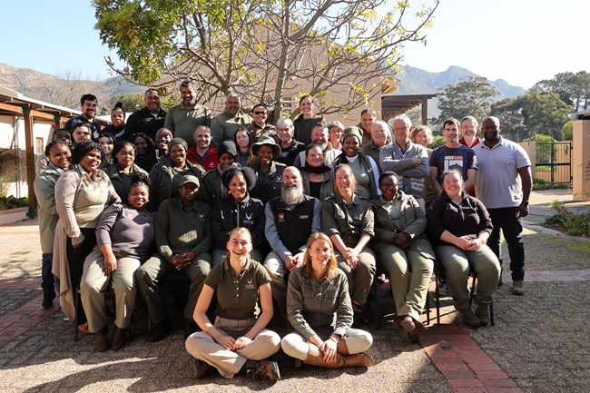 The climate change conference attendees sit for a photo.